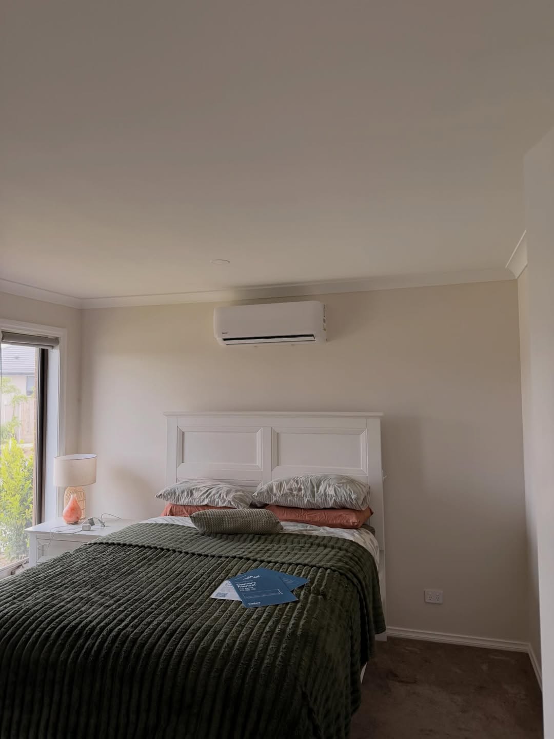 A reverse-cycle wall split heating and cooling a living room